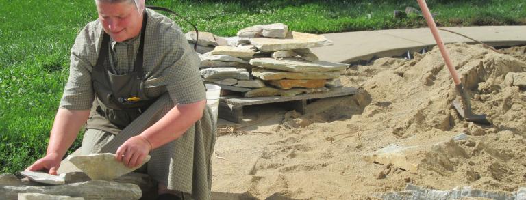 Esther building a new crevice  bed in her garden